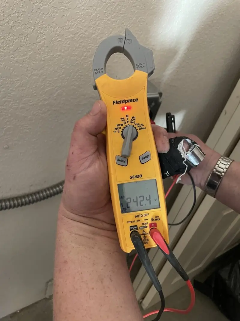 Voltage testing with clamp meter during Recessed Lighting Installation in Reynoldsburg